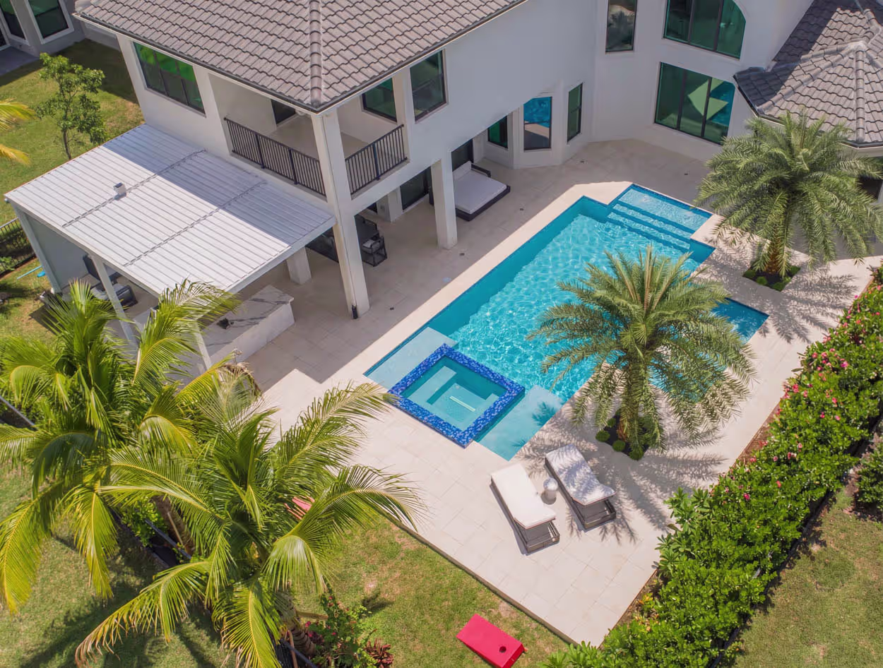 Luxury custom pool design in North Florida featuring modern architecture, premium decking, and upscale outdoor living space.