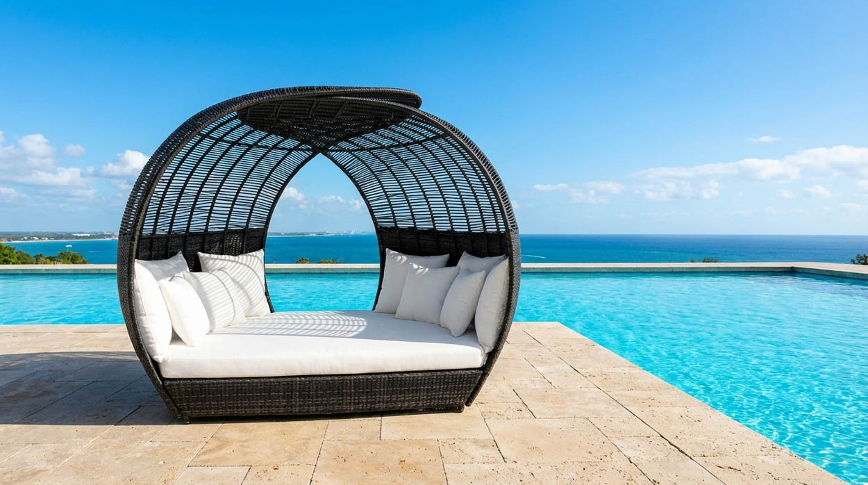 Modern outdoor cabana-style seating installed next to infinity pool in South Florida, built for high-end residential projects.