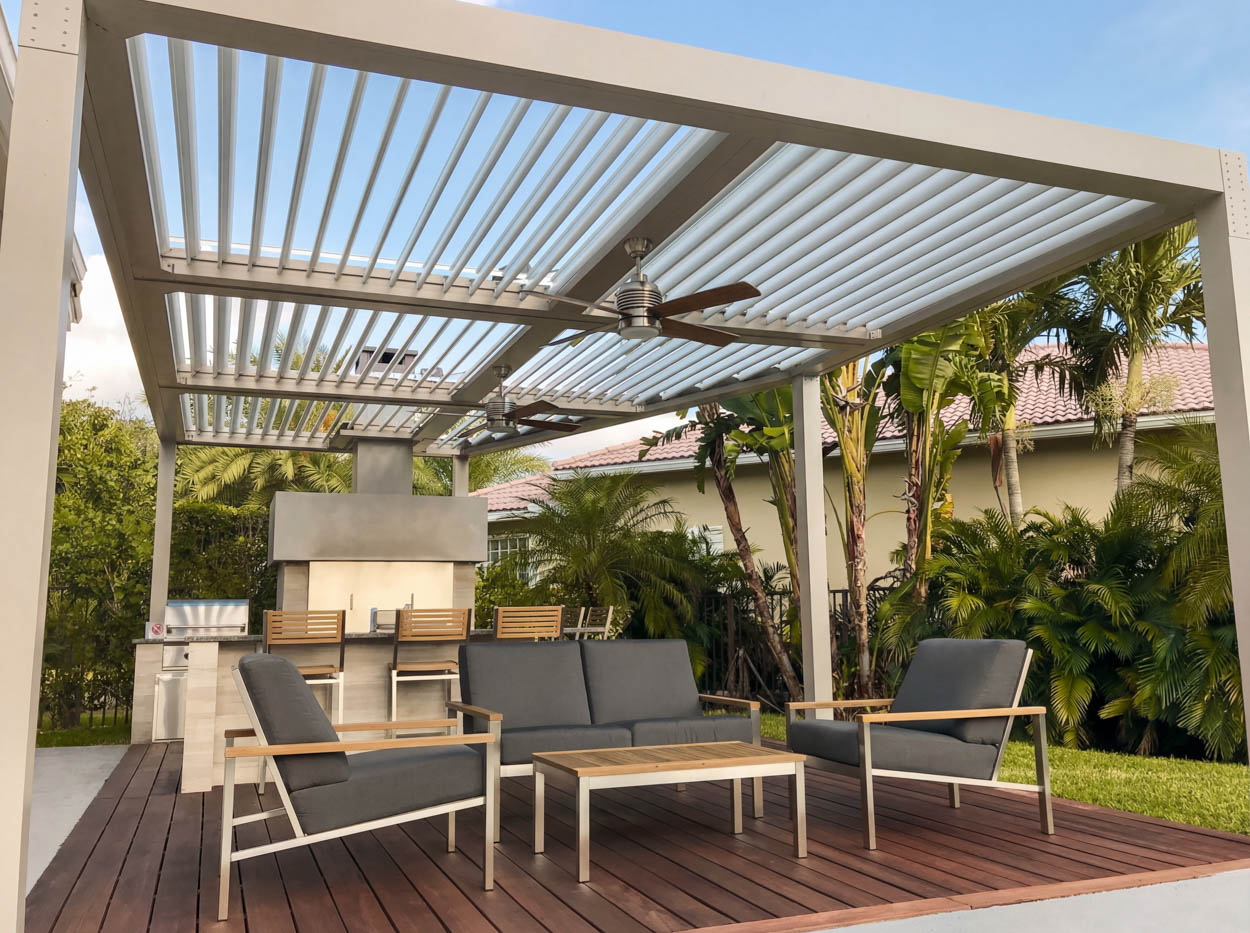 Louvered roof installation with modern frame and rotating panels, built for shade control and outdoor comfort.