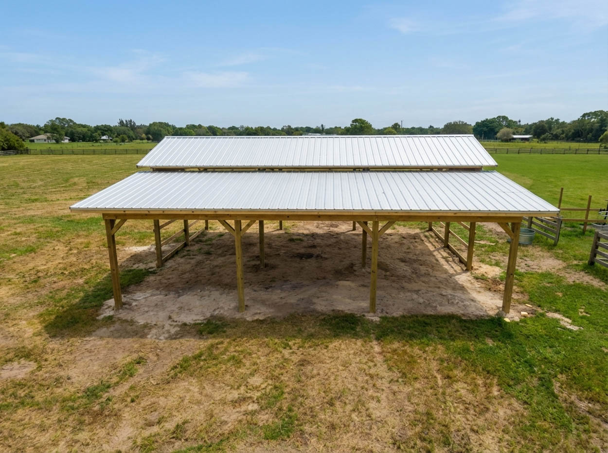Custom-built steel pole barn with open sides, offering versatile coverage solutions across South Florida properties.