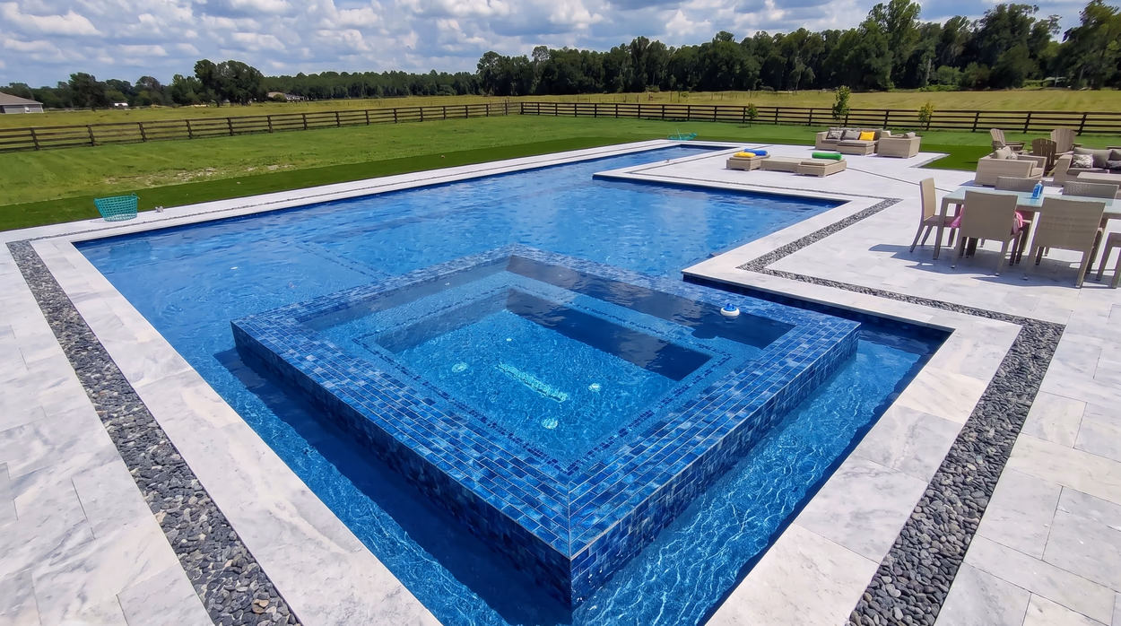 Pool edge and surrounding lawn on North Florida acreage, part of a project by Mr & Mrs Outdoor Living