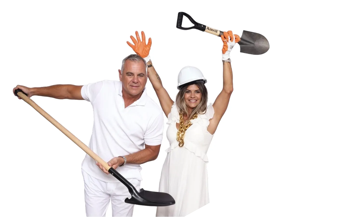 Man and woman wearing white holding shovels, woman also wears a white safety helmet and orange gloves.